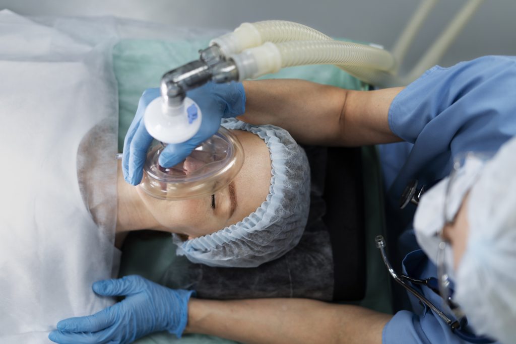 Nurse putting oxygen mask patient